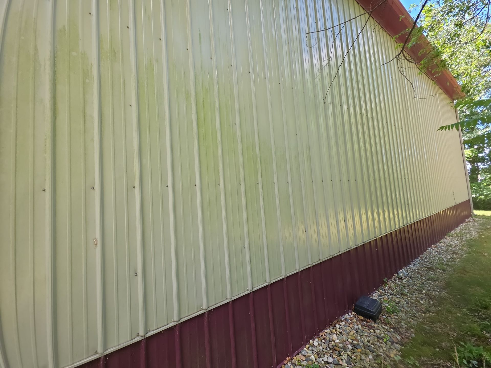 Years Of Organic Growth And Green Algae On This Metal Siding Can Be Safely Removed With Our Low-Pressure Soft Washing Process. Pole Barn Soft Washing. Double A Power Washing