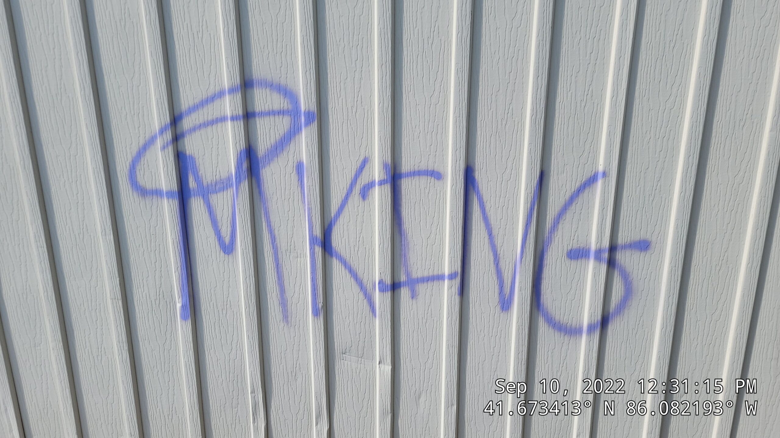 Graffiti Removal For Commercial Properties In Elkhart In: Who Is Responsible And What Happens When You Wait Too Long 3 Vandalism Like Spray Paint Graffiti On Vinyl Siding Requires Professional Restoration To Safely Lift The Paint Without Damaging The Siding'S Texture. Graffiti And Gum Removal. Double A Power Washing